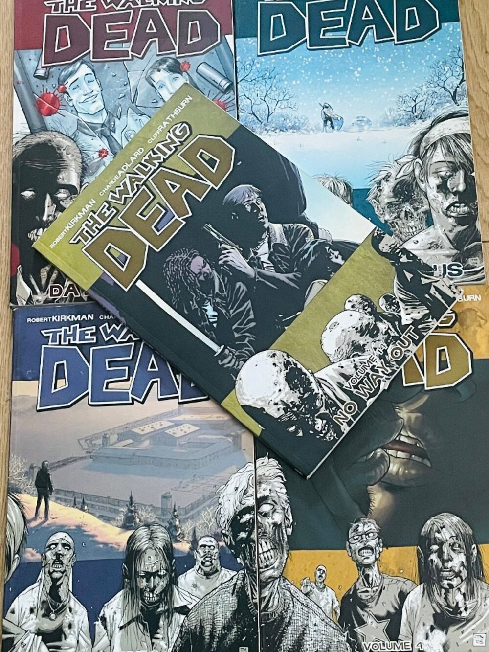 "The Walking Dead" ~ Volume 1, 2, 3, 4 & 14 by Robert Kirkman & others.